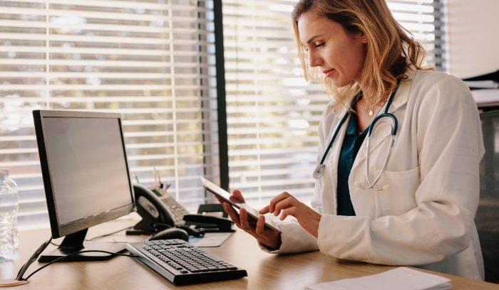 Doctor accessing an EHR from her tablet