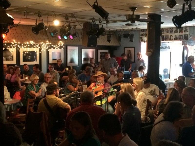 Photo of a songwriters round at The Bluebird Cafe in Nashville.