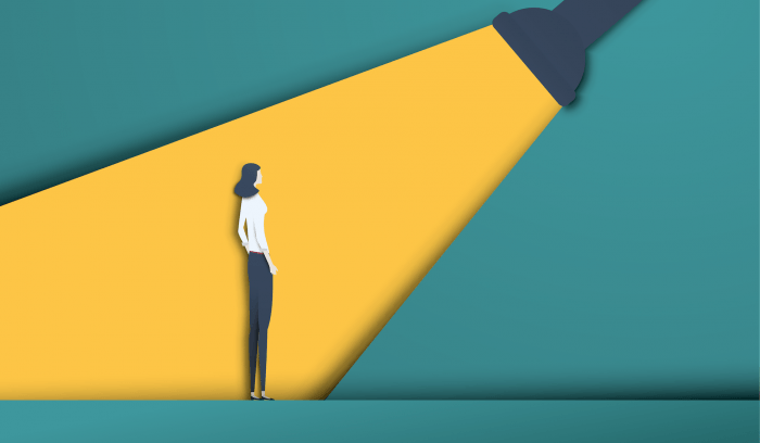 Illustration of a recruiter shining a spotlight on a female candidate.
