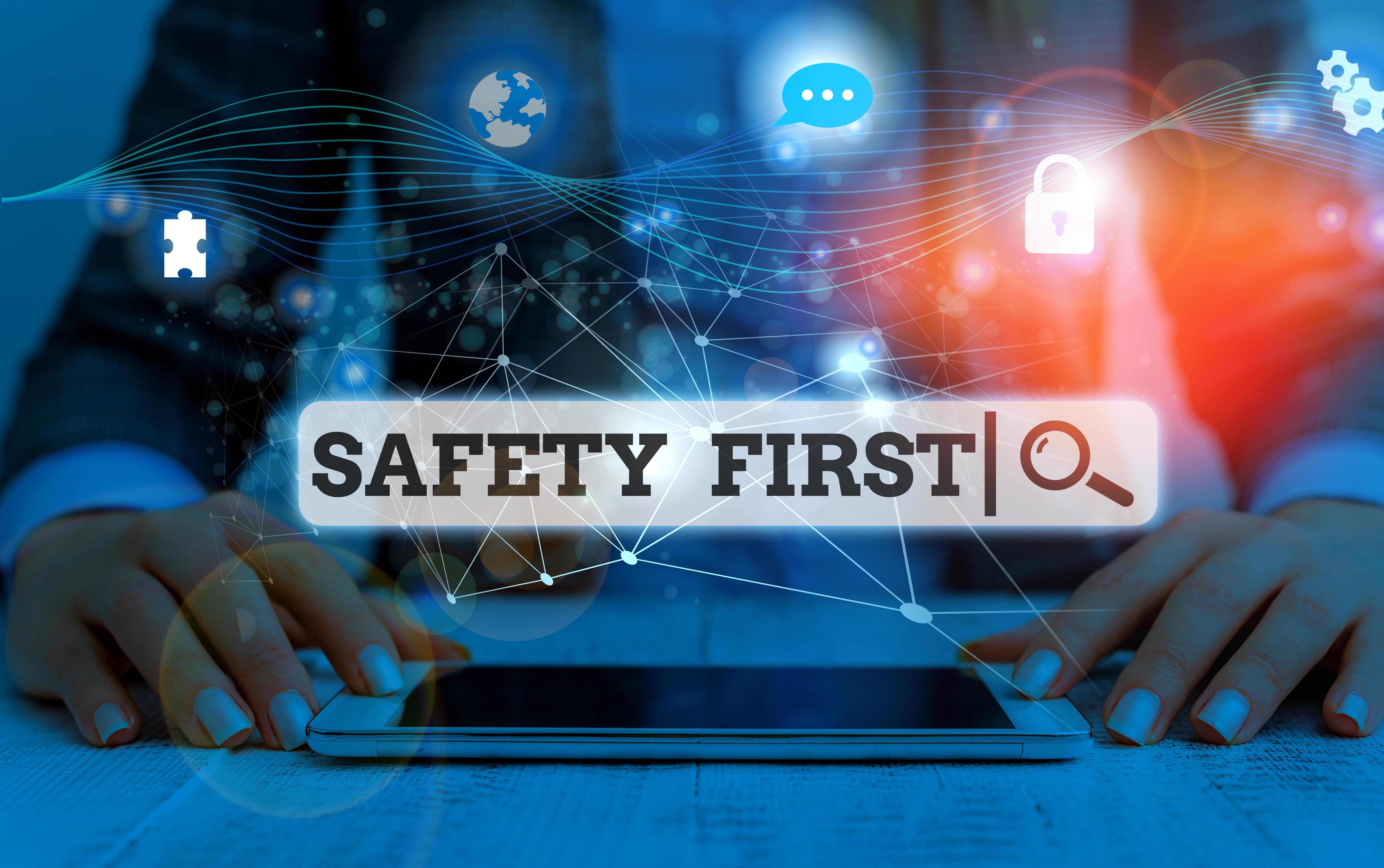 Conceptual hand writing showing Safety First. Concept meaning used to say that the most important thing is to be safe Picture photo network scheme with modern smart device