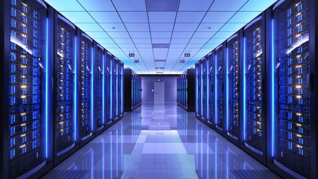 Big data server racks in server room data center.