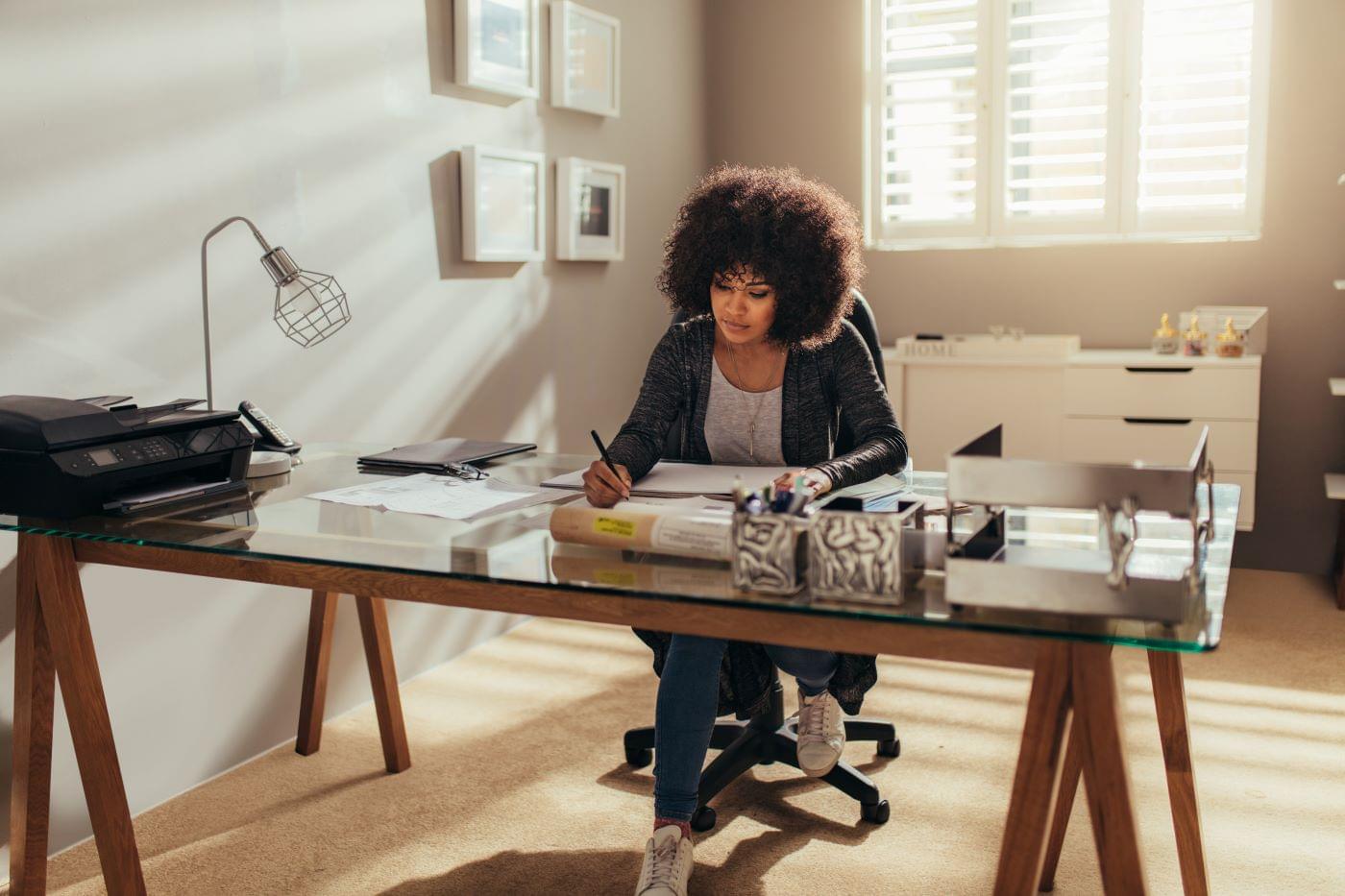Female business leader working at her desk.