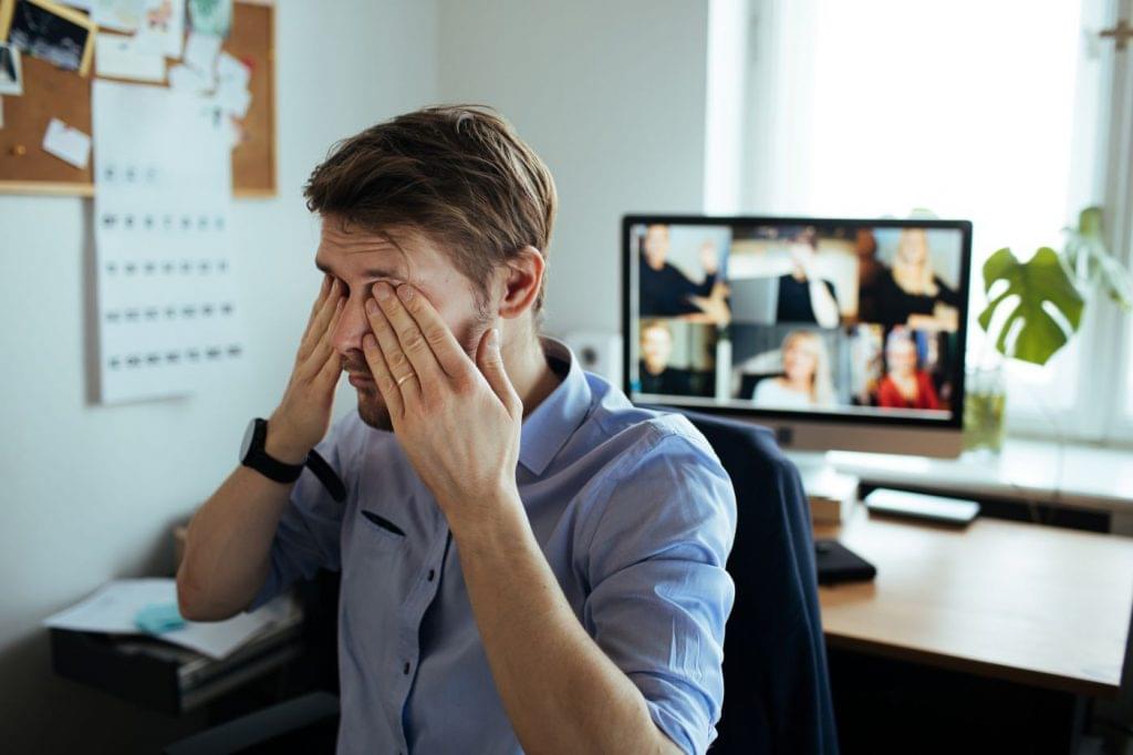 Man feeling burnout from work stress.
