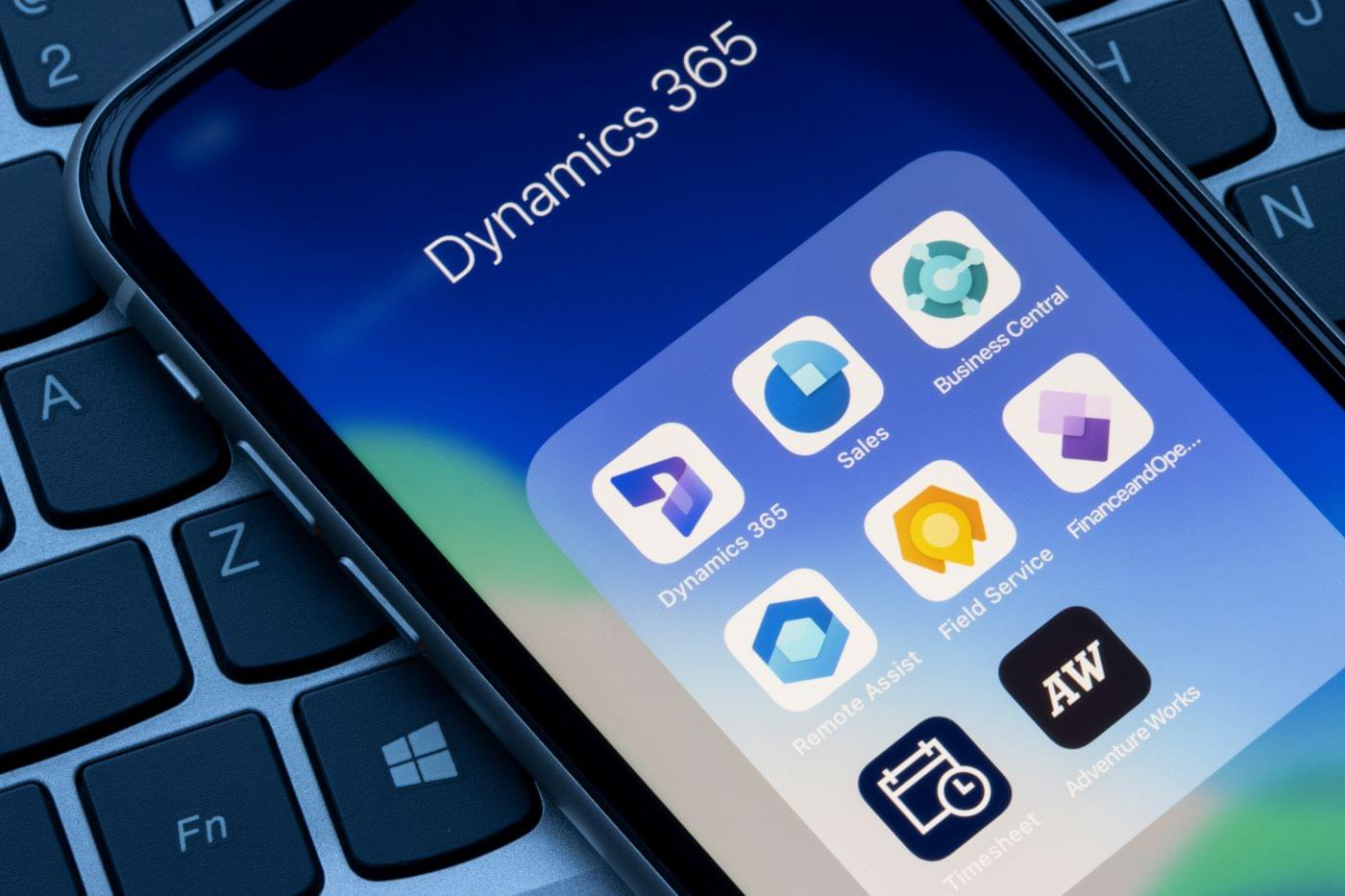 Cellphone showing a Microsoft Dynamics 365 application folder.