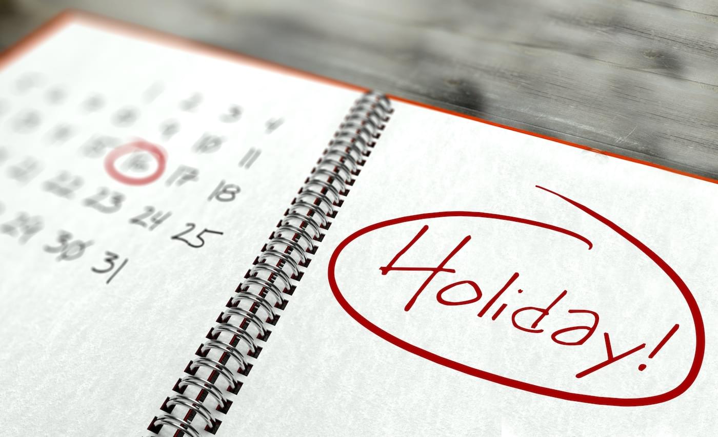 Photo of calendar with "holiday" written and circled in red.