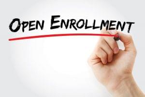 Hand writing Open enrollment with marker.