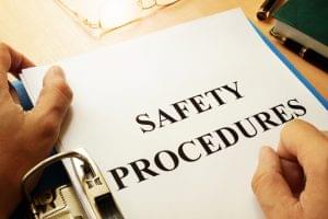 An employee reading a safety procedure document.